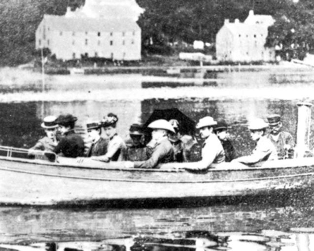 historic photo of the first students at the Brooklyn Institute Laboratory in a boat on the harbor circa 1890