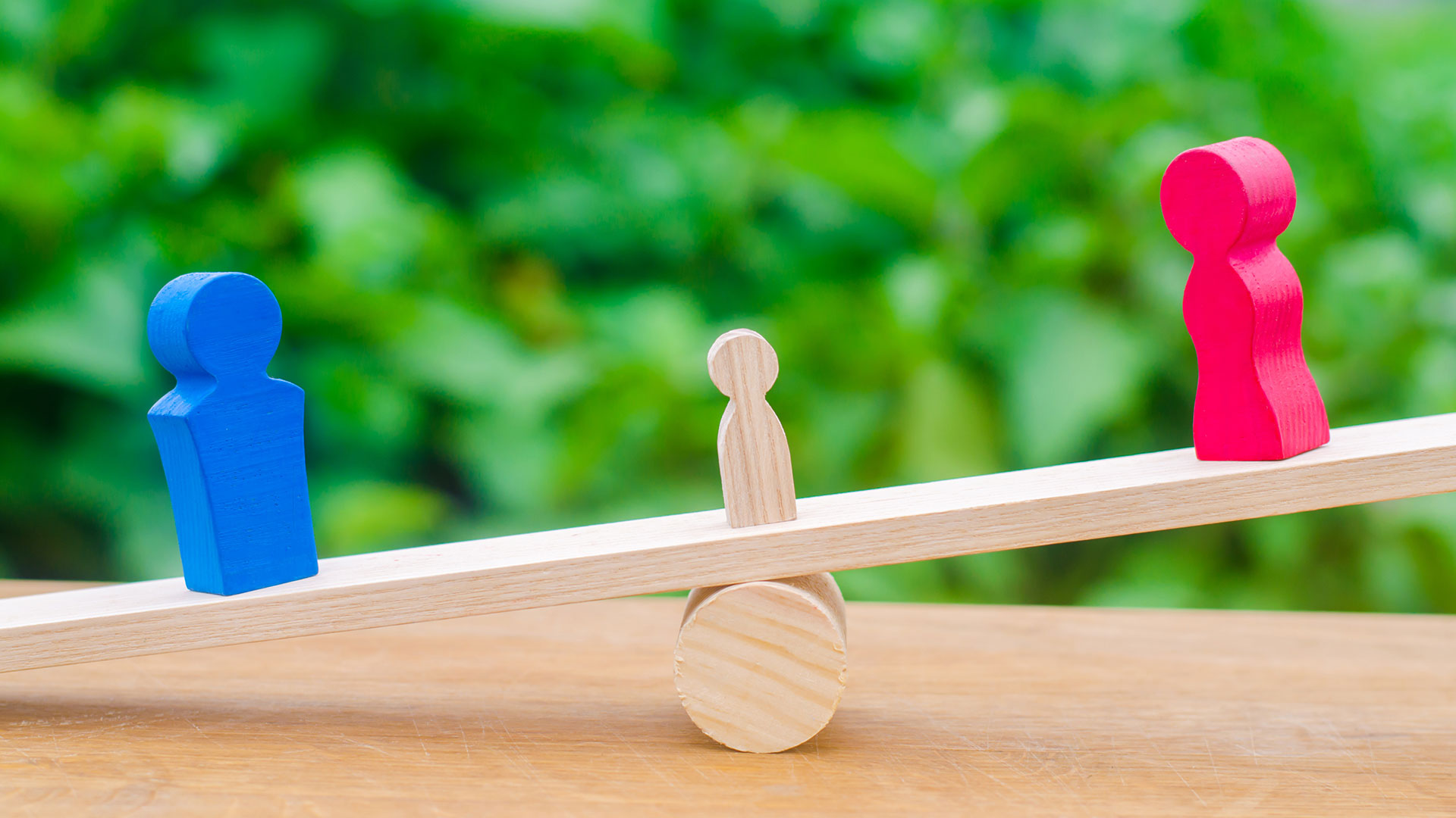 Photo of family wood carvings balancing on scale