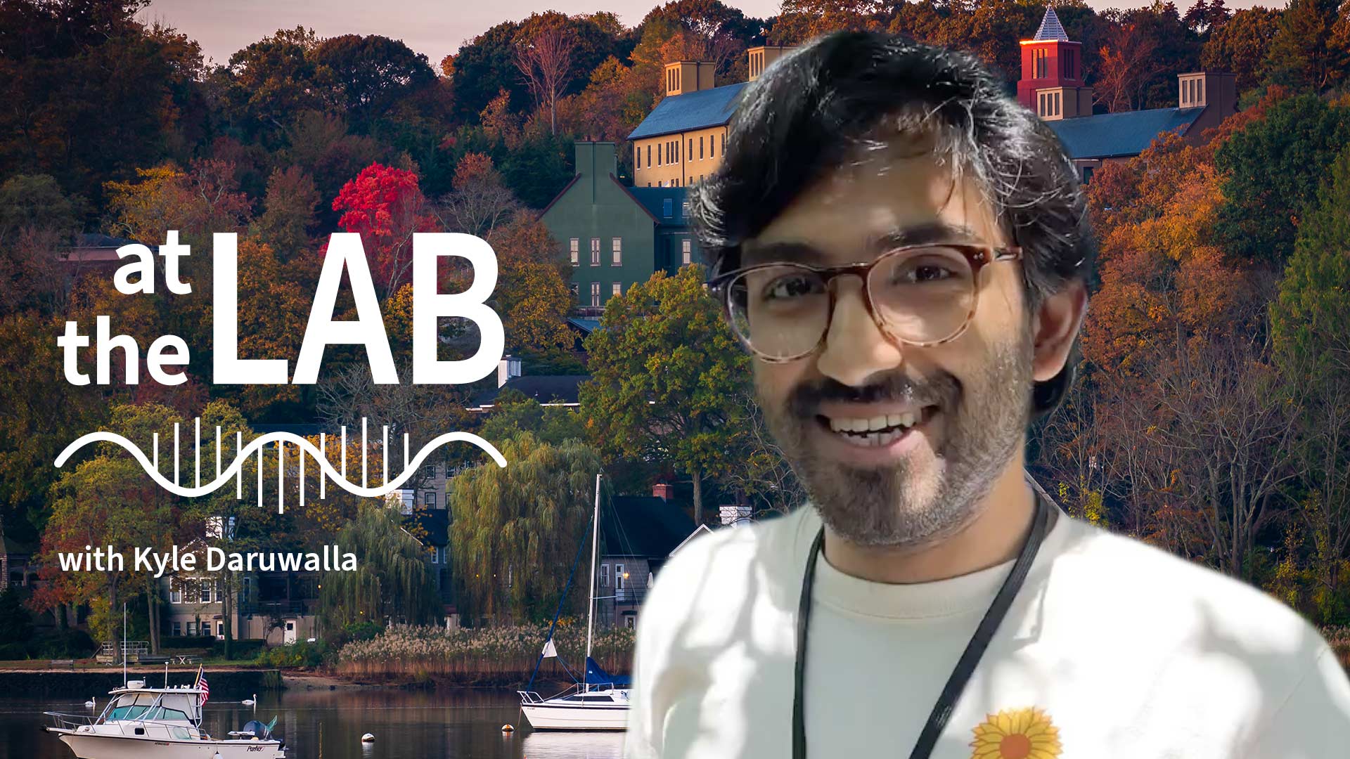image of Cold Spring Harbor campus from across the harbor with At the Lab podcast logo and portrait of Kyle Daruwalla