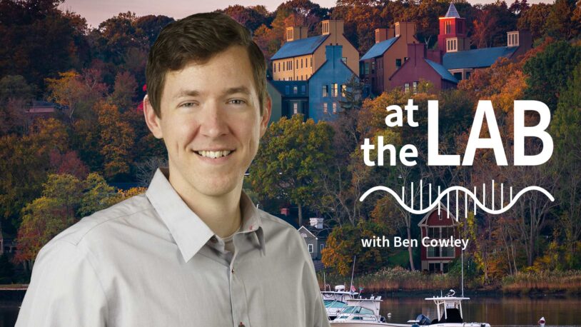 image of Cold Spring Harbor campus from across the harbor with At the Lab podcast logo and portrait of Ben Cowley