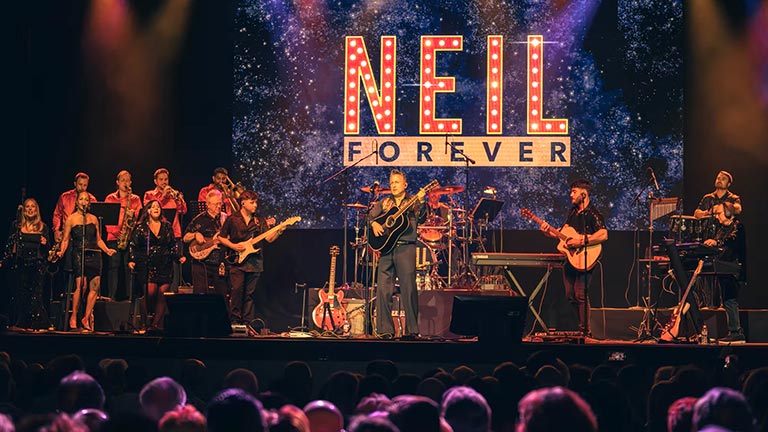 image from the stage play Neil Forever performs Neil Diamond