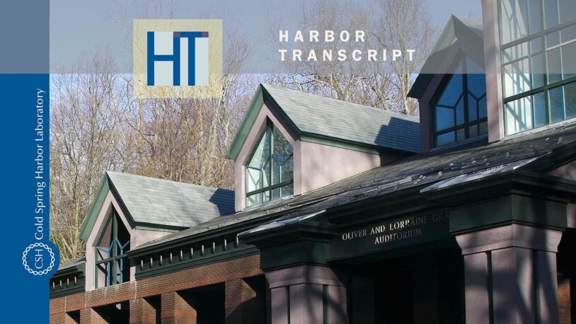 The image shows the exterior of a building with peaked roofs and large windows. Text reads Harbor Transcript and Cold Spring Harbor Laboratory, with a logo and an auditorium sign visible.