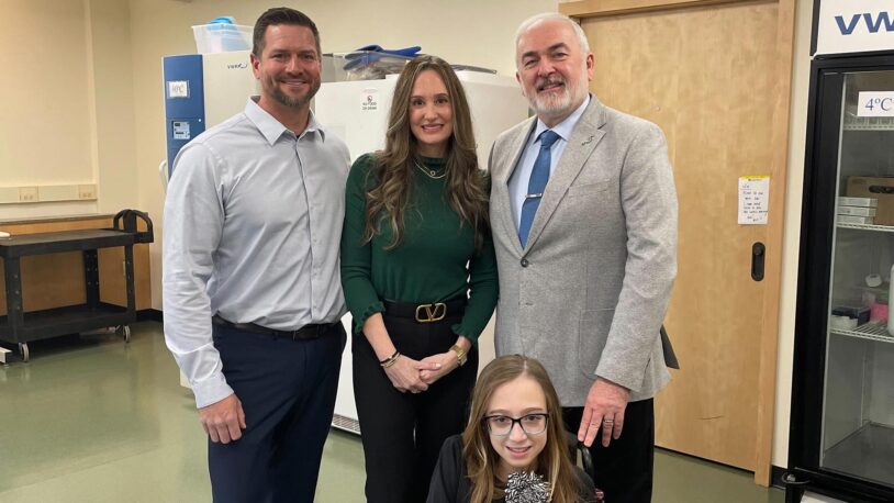 Image of Adrian Krainer with the Larson family at the lab